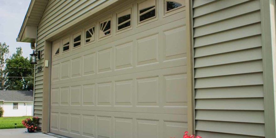 Raised steel panel garage door